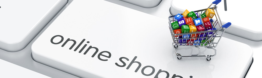 Weiße Tastaturtaste mit Schriftzug online shopping und Einkaufswagen voller bunter App-Symbole als Symbol für digitalen Einkauf